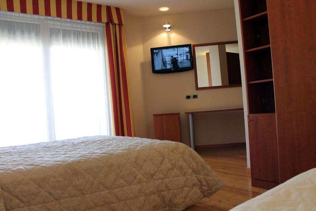 Postel nebo postele na pokoji v ubytování Hotel Rubicone