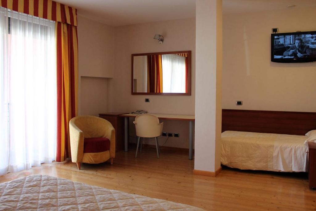 Postel nebo postele na pokoji v ubytování Hotel Rubicone