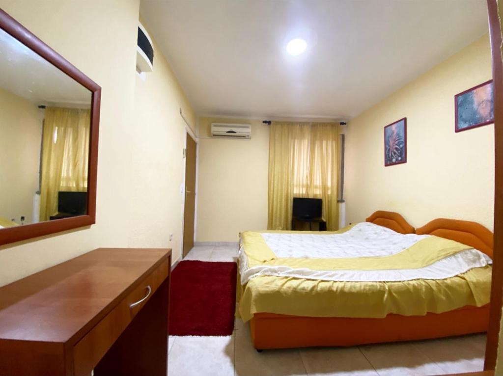 Postel nebo postele na pokoji v ubytování Apartmani Vila Marija