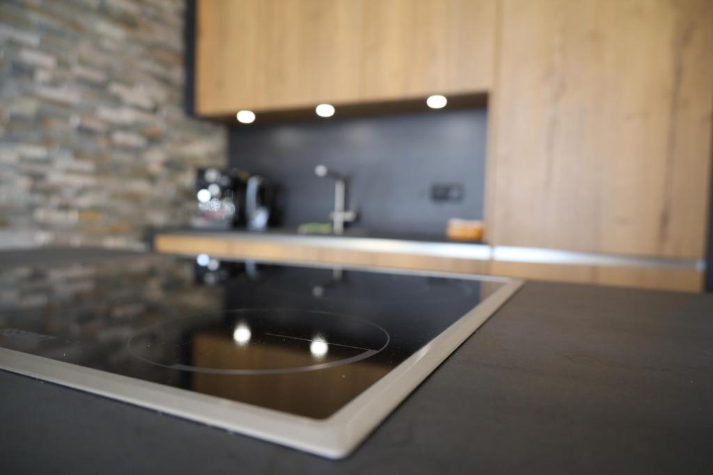 Kuchyň nebo kuchyňský kout v ubytování Gschwendtalm Tirol - Luxus-Apartment für Ihre Auszeit