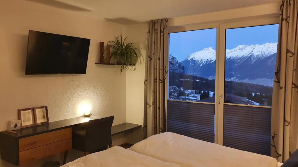 Nespecifikovaný výhled na hory nebo výhled na hory při pohledu z apartmánu