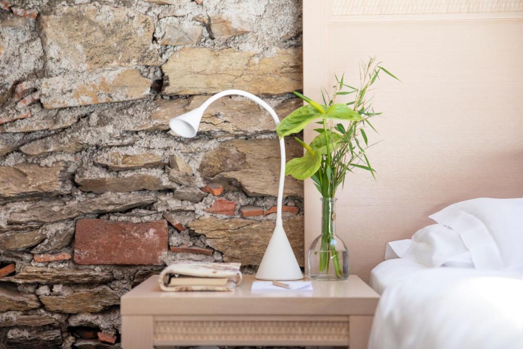 Ένα ή περισσότερα κρεβάτια σε δωμάτιο στο Relais Villa Porta