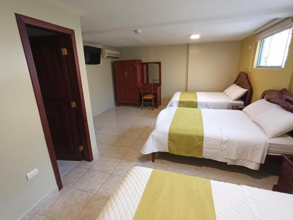 Postel nebo postele na pokoji v ubytování Hotel Cayapas Esmeraldas
