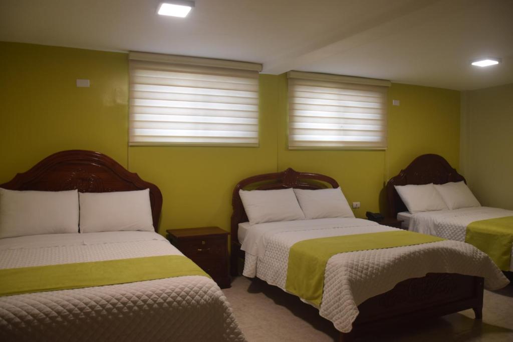 Postel nebo postele na pokoji v ubytování Hotel Cayapas Esmeraldas