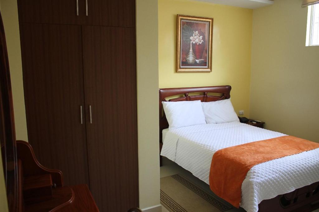 Postel nebo postele na pokoji v ubytování Hotel Cayapas Esmeraldas