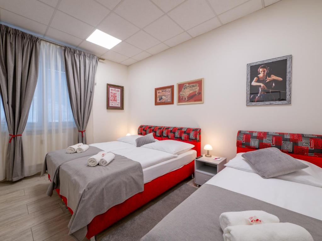 Postel nebo postele na pokoji v ubytování Apartmany Style