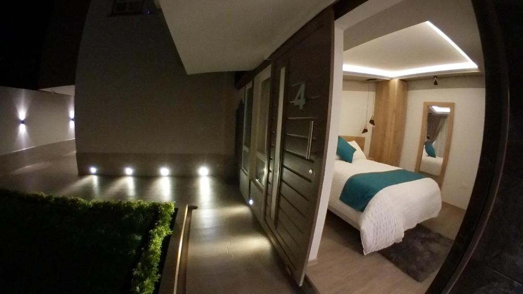 Postel nebo postele na pokoji v ubytování Asher Hospedaje y Turismo