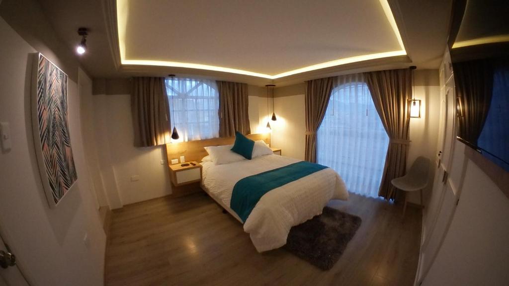 מיטה או מיטות בחדר ב-Asher Hospedaje y Turismo