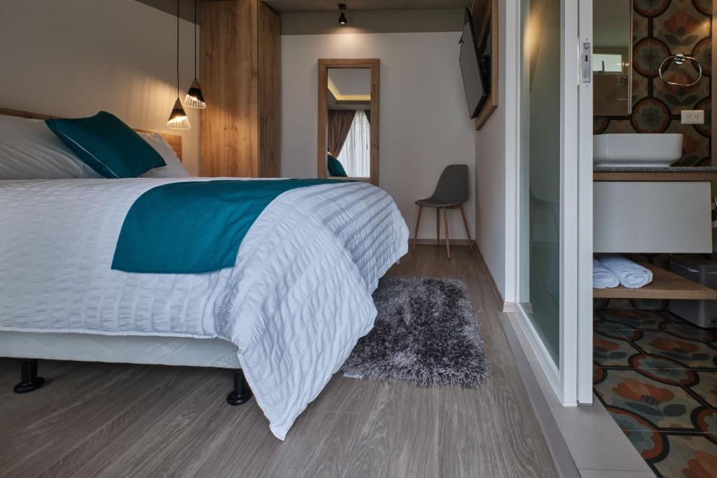 Postel nebo postele na pokoji v ubytování Asher Hospedaje y Turismo