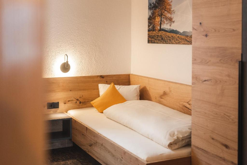 Postel nebo postele na pokoji v ubytování An der Via Claudia Augusta