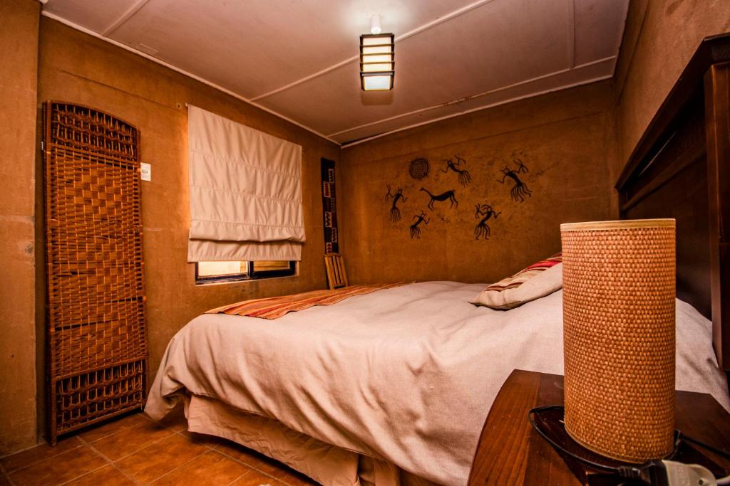 Postel nebo postele na pokoji v ubytování Incahuasi Travelodge