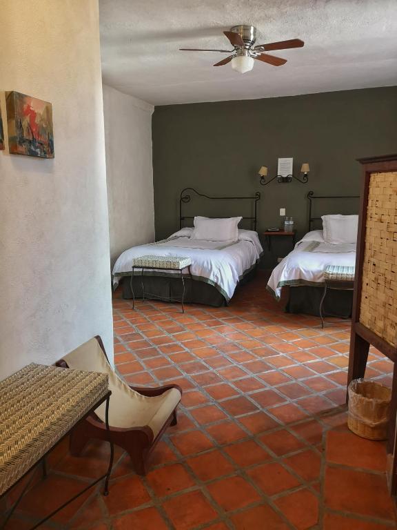 Postel nebo postele na pokoji v ubytování Hotel Casa Morena