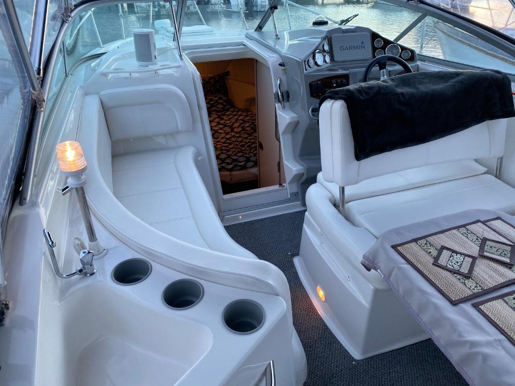 a white boat with the back seat of it at Chamerops in Ouistreham