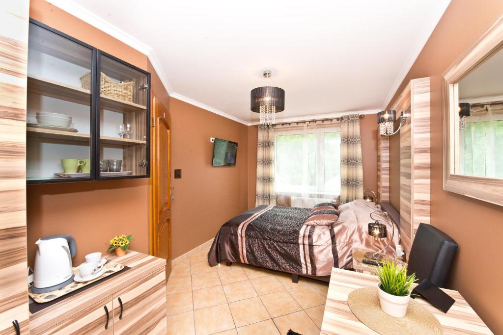 Postel nebo postele na pokoji v ubytování POKOJE GOŚCINNE ATOL