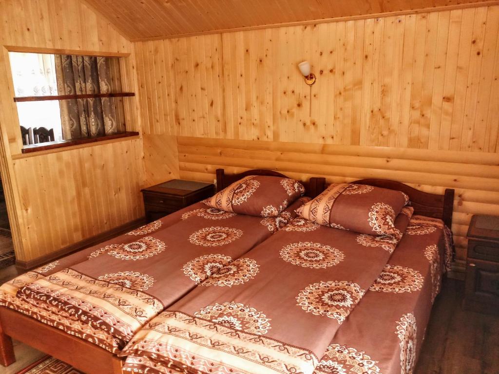 Postel nebo postele na pokoji v ubytování Садиба "У Валентини"