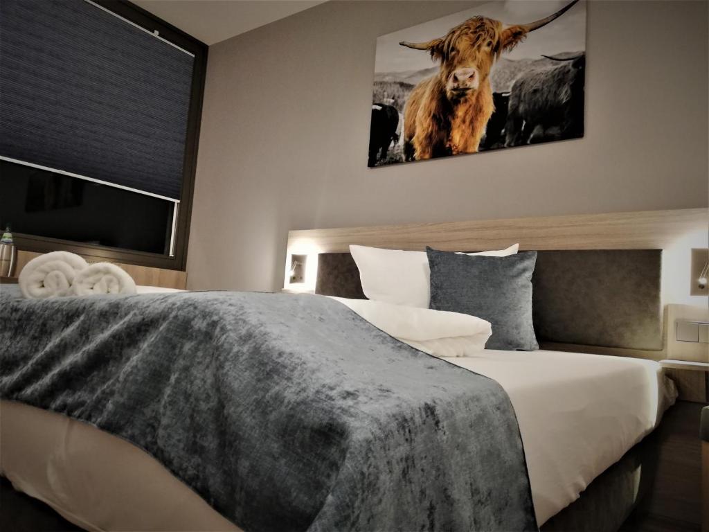 Postel nebo postele na pokoji v ubytování Hotel & Restaurant Alte Molkerei Kölleda
