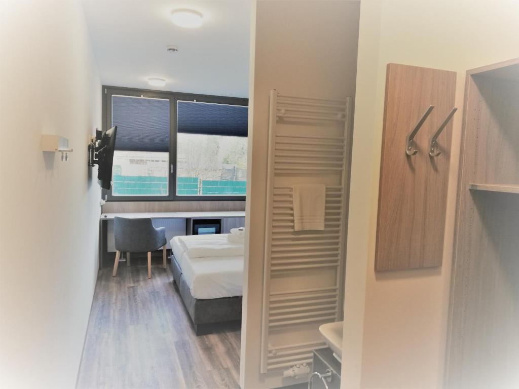 Postel nebo postele na pokoji v ubytování Hotel & Restaurant Alte Molkerei Kölleda