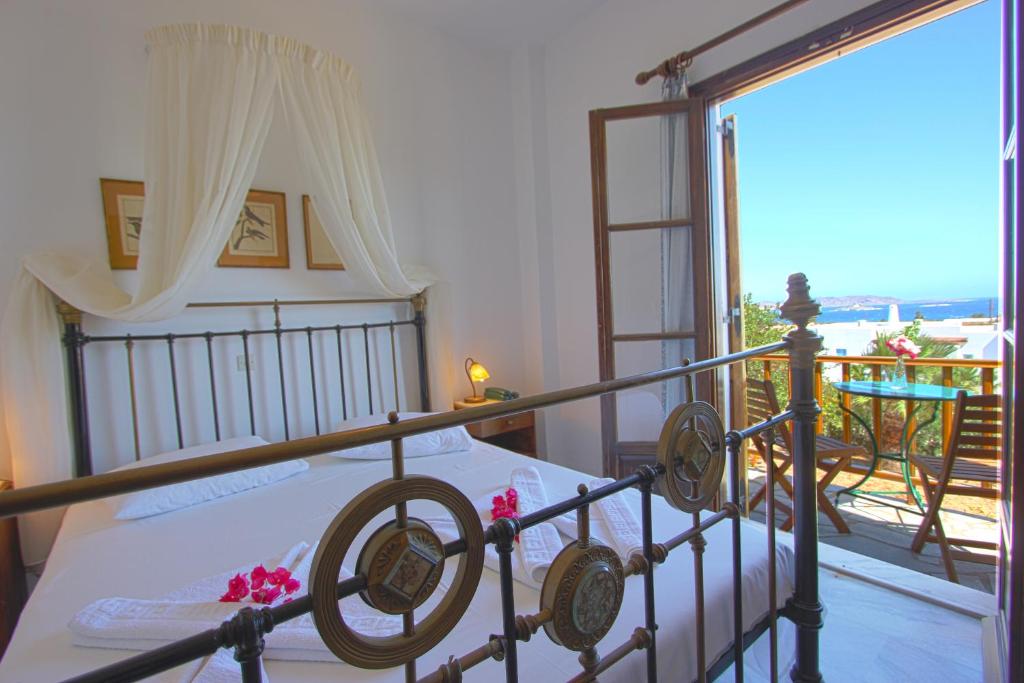 Postel nebo postele na pokoji v ubytování Hotel Swiss Home