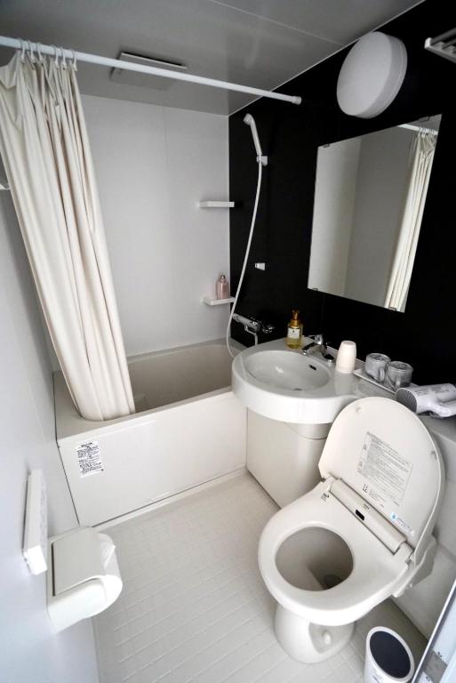 Koupelna v ubytování Plaza In Kanku Hotel
