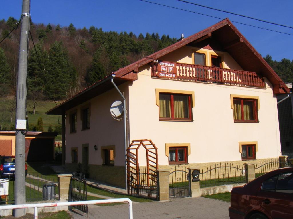 a large white house with a balcony at Domino in Korytné