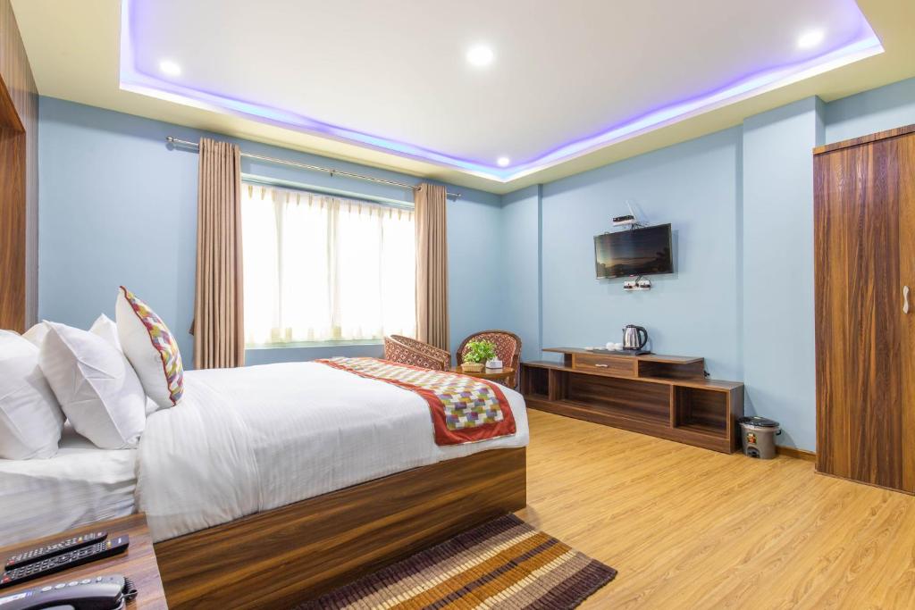 Letto o letti in una camera di Siddhartha Hotel Grand City