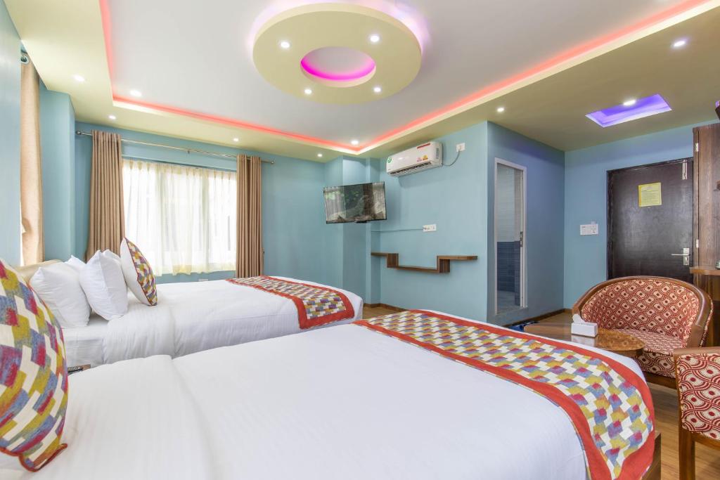 Letto o letti in una camera di Siddhartha Hotel Grand City