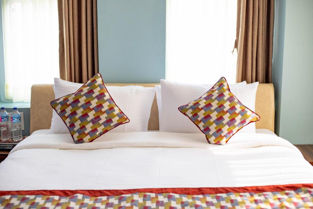 Letto o letti in una camera di Siddhartha Hotel Grand City