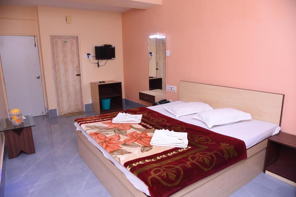 Postel nebo postele na pokoji v ubytování Hotel SagarPriya