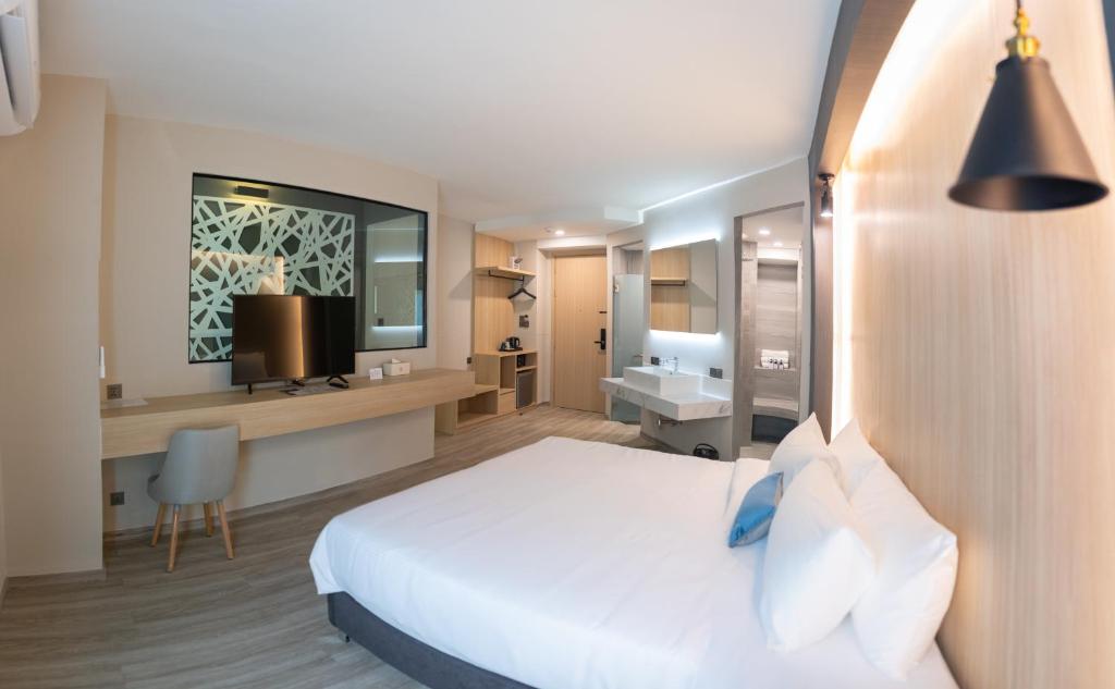Postel nebo postele na pokoji v ubytování 56 Hotel
