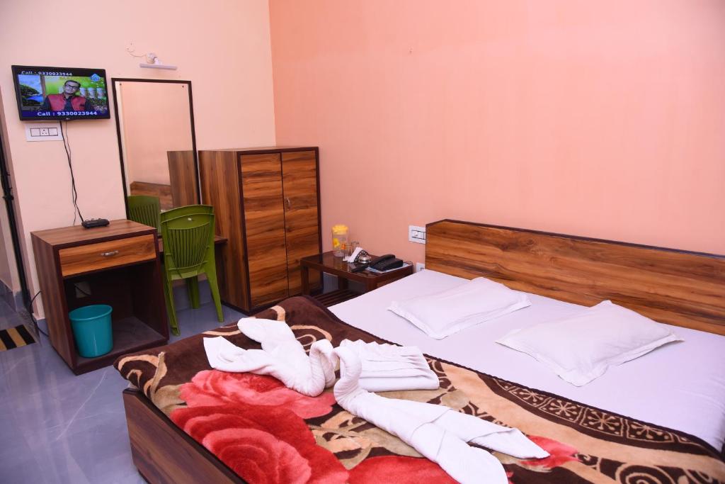 Postel nebo postele na pokoji v ubytování Hotel SagarPriya