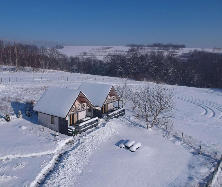 an aerial view of a house in the snow at Apartamenty Żywiec in Żywiec