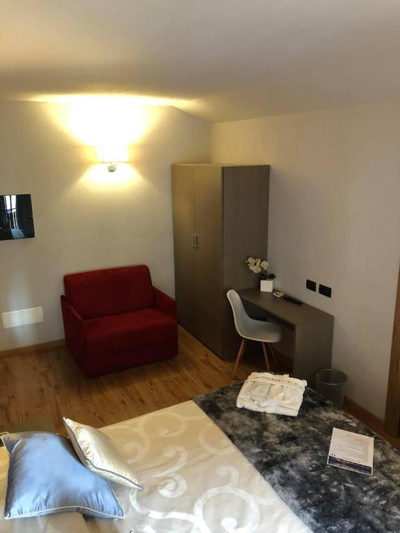 Postel nebo postele na pokoji v ubytování Hotel Berlinghera