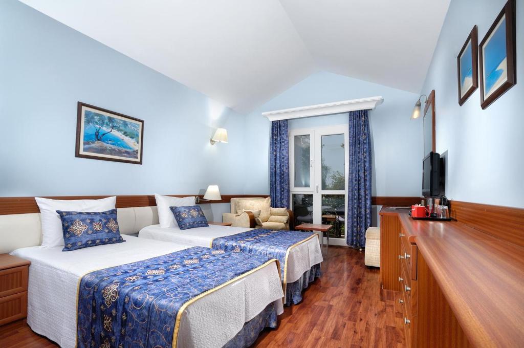 Postel nebo postele na pokoji v ubytování Belcekiz Beach Club - All Inclusive