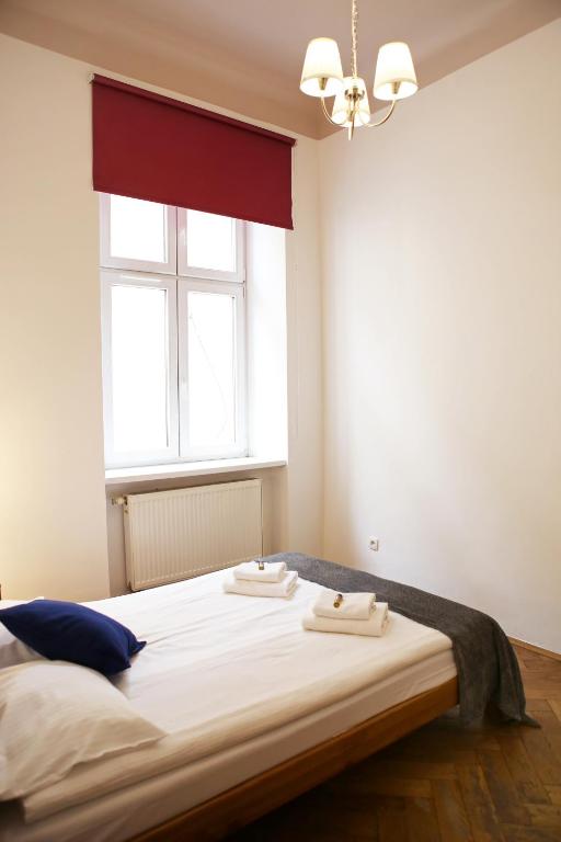 Posteľ alebo postele v izbe v ubytovaní Classic apartments Pilsudskiego street