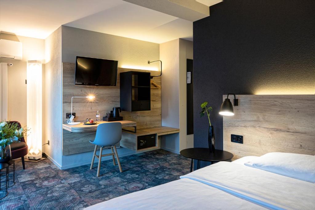 Una cama o camas en una habitación de Baxter Hotel