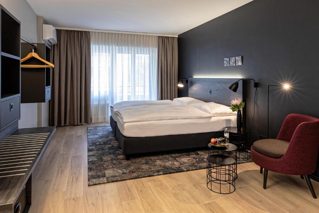 Una cama o camas en una habitación de Baxter Hotel