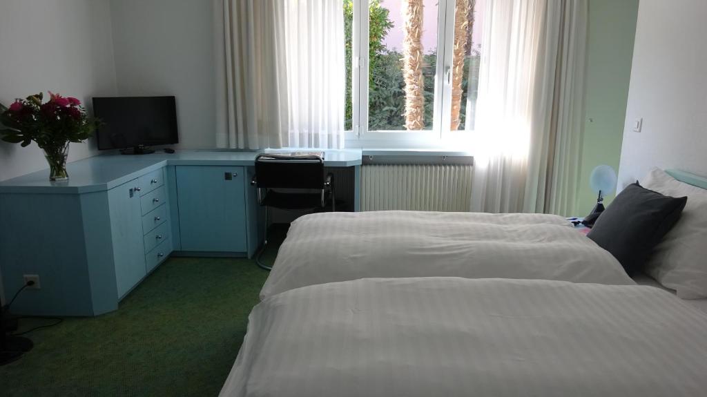 Postel nebo postele na pokoji v ubytování Villa Garni Gardenia