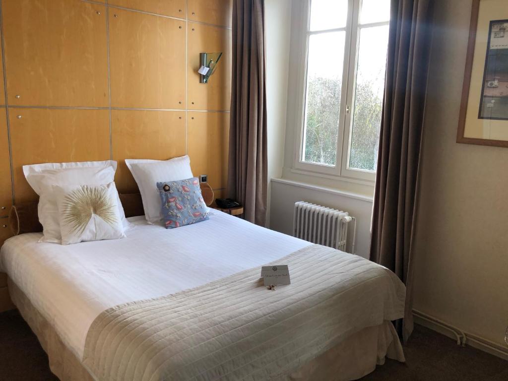 Postel nebo postele na pokoji v ubytování L'Hôtel Particulier Ascott