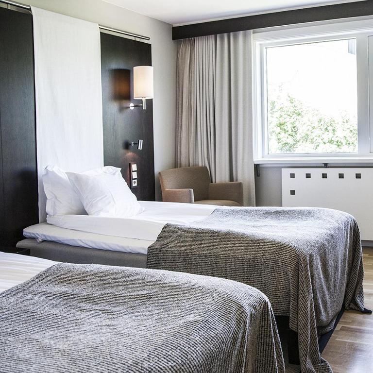 Ένα ή περισσότερα κρεβάτια σε δωμάτιο στο Hotel Tylösand