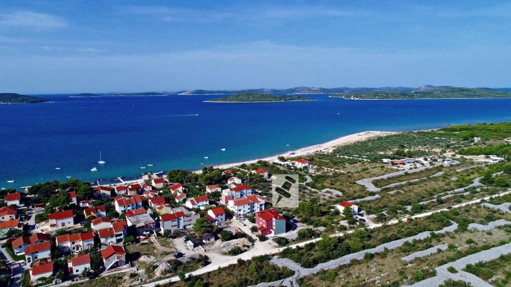 an aerial view of a small town next to the water at Apartments Saric 2 in Jadrija