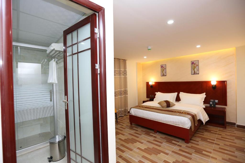 Postel nebo postele na pokoji v ubytování Venus Hotel