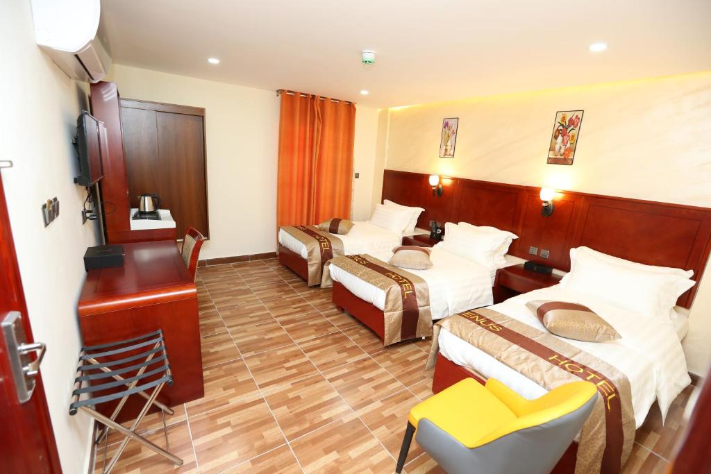 Postel nebo postele na pokoji v ubytování Venus Hotel