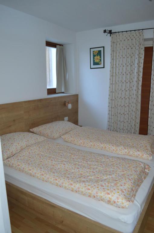 Postel nebo postele na pokoji v ubytování Isidorhof