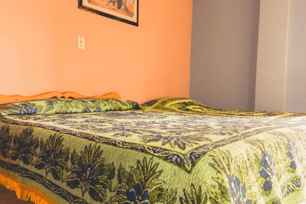 Postel nebo postele na pokoji v ubytování Hotel Felicina