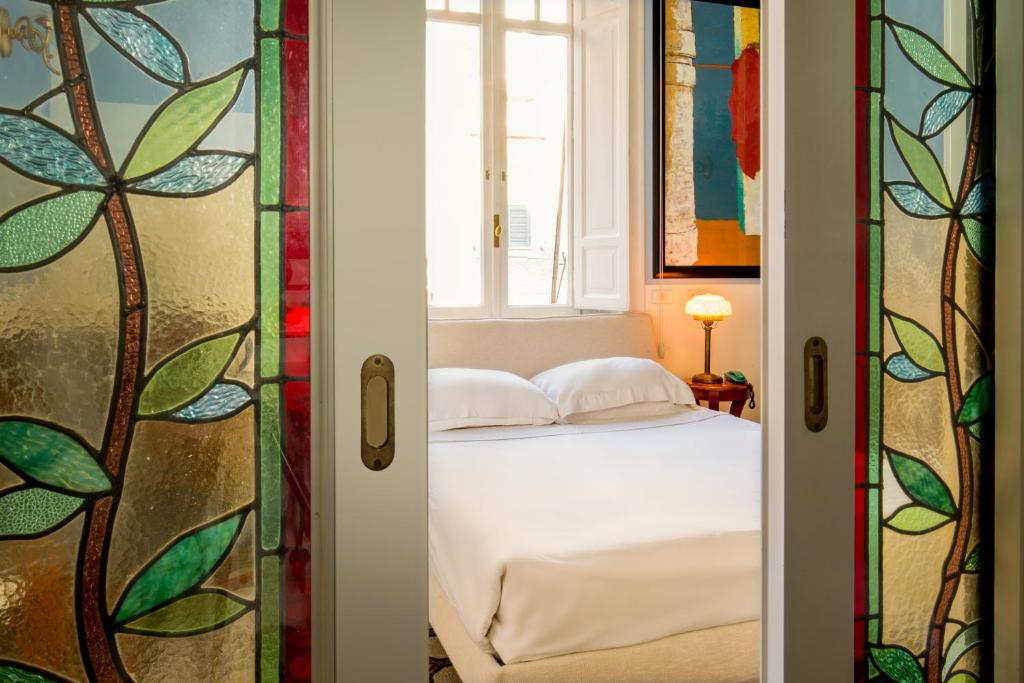 Postel nebo postele na pokoji v ubytování Hotel Emona Aquaeductus