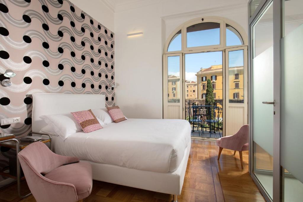 Postel nebo postele na pokoji v ubytování Hotel Emona Aquaeductus