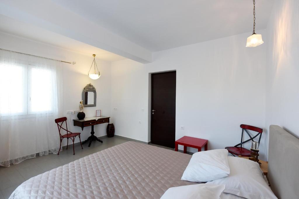 Postel nebo postele na pokoji v ubytování Tsakanos Home