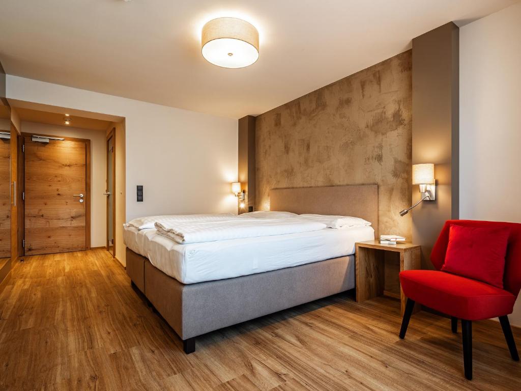 Posteľ alebo postele v izbe v ubytovaní Stadthotel EGGERBRÄU
