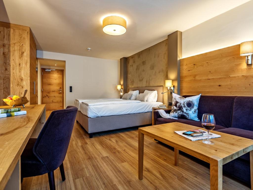 Posteľ alebo postele v izbe v ubytovaní Stadthotel EGGERBRÄU