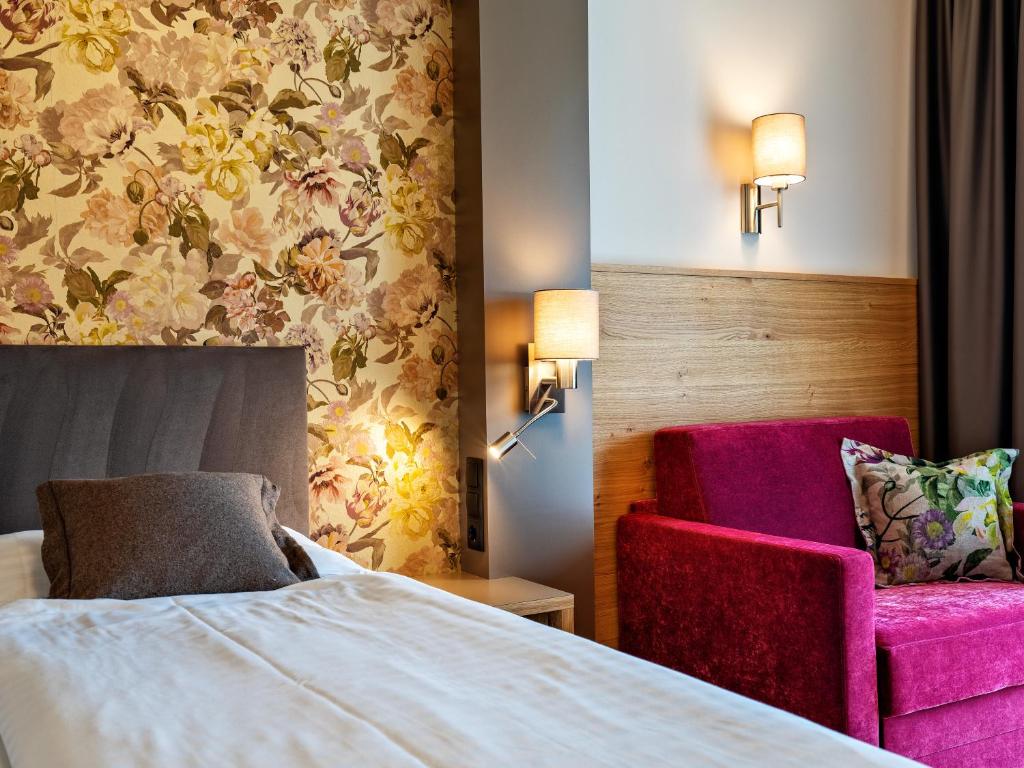 Posteľ alebo postele v izbe v ubytovaní Stadthotel EGGERBRÄU